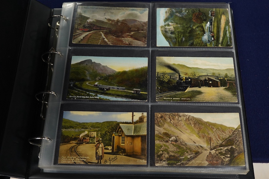 A collection of early 20th century railway related postcards, contained within two modern postcard albums, mainly pre-grouping railway companies including; the GWR, the LNWR, the Caledonian Railway, the Great North of Sc